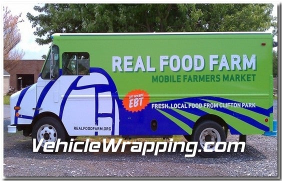 Custom signage on delivery truck showcasing branding and marketing impact