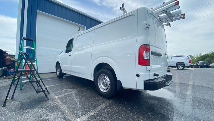 Tail end of white fleet van