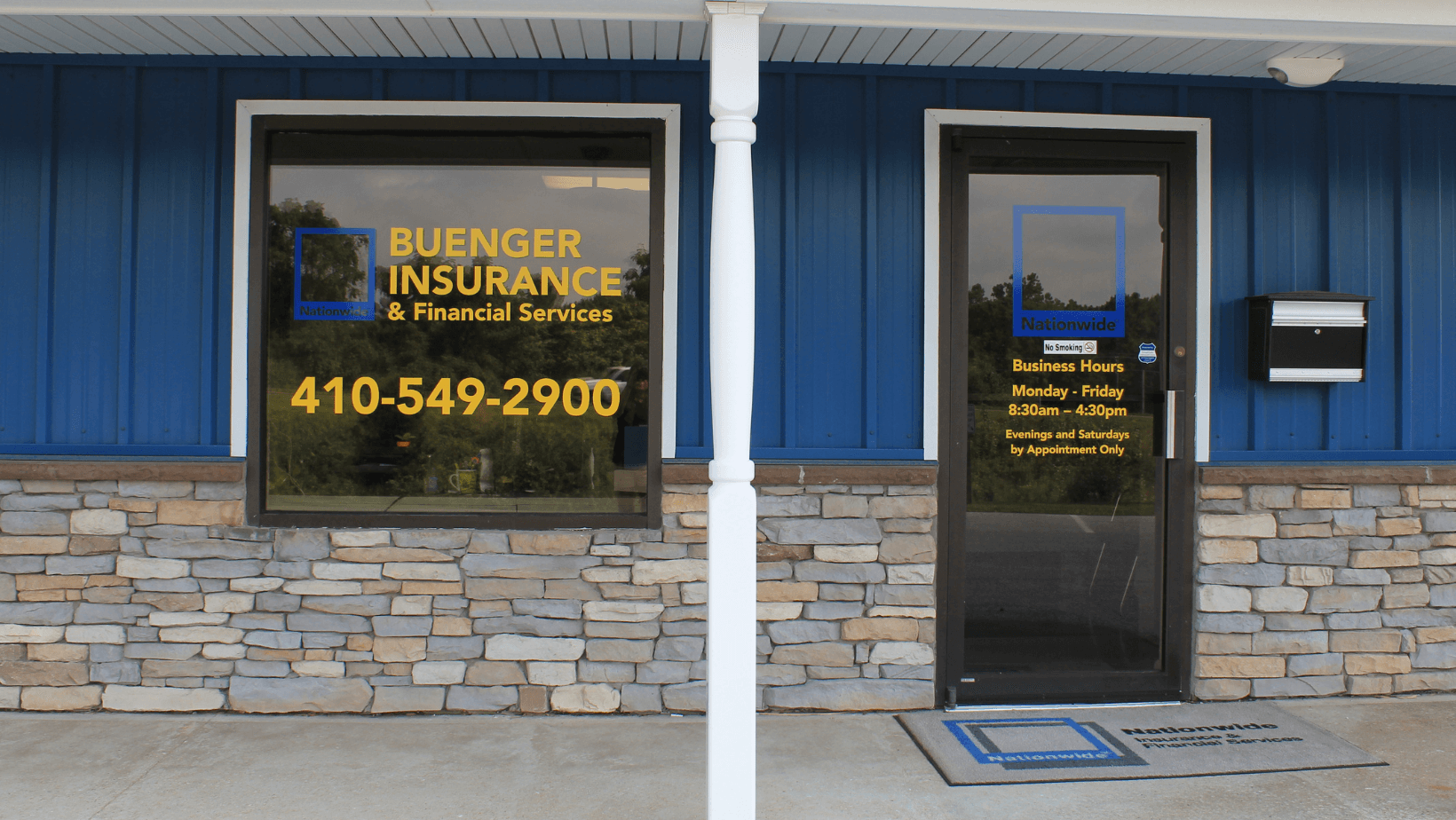 blue-and-yellow-lettering-installed-on-business-entrance-and-window