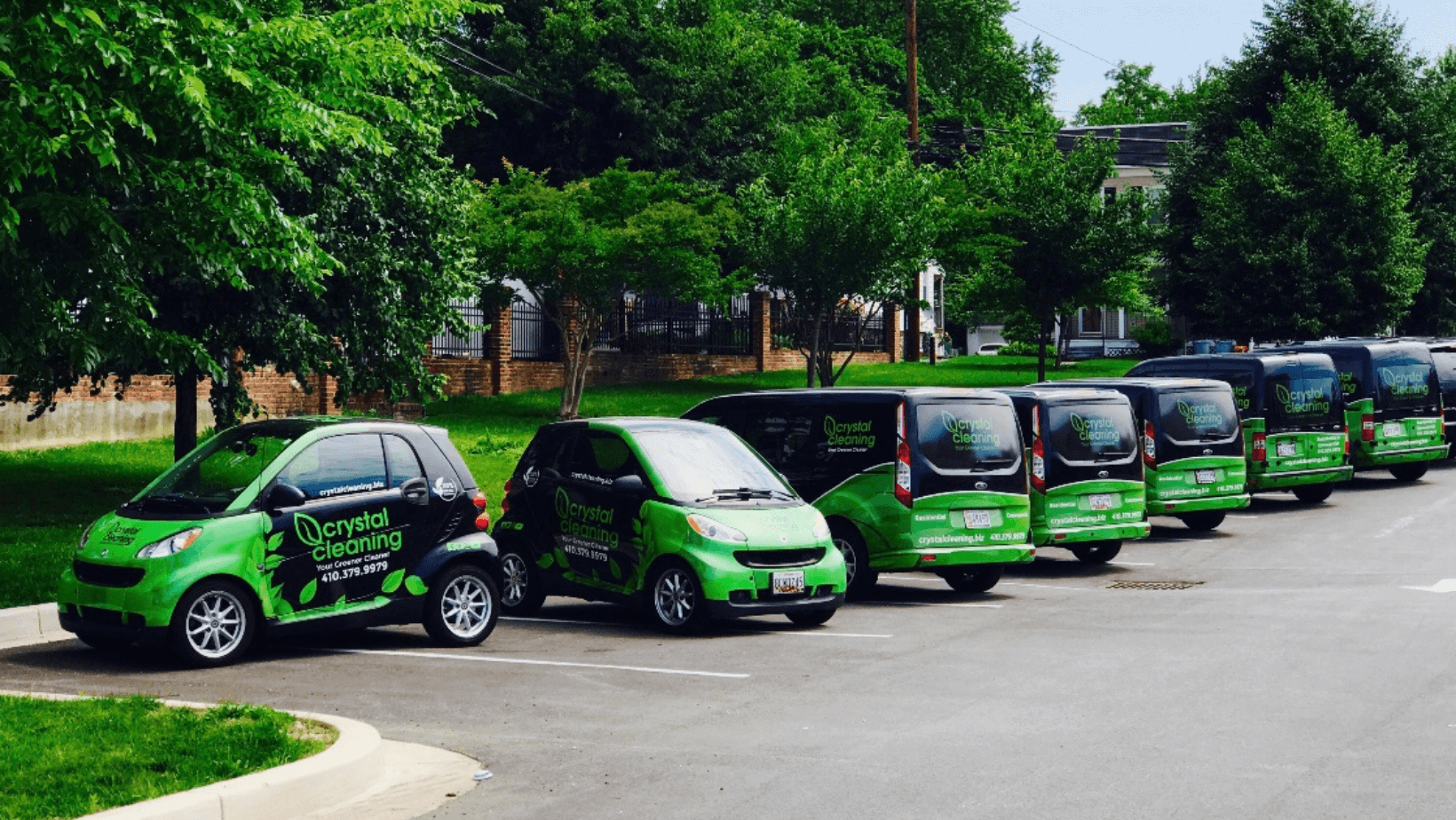fleet-of-black-smart-cars-with-green-bumpers-and-lettering
