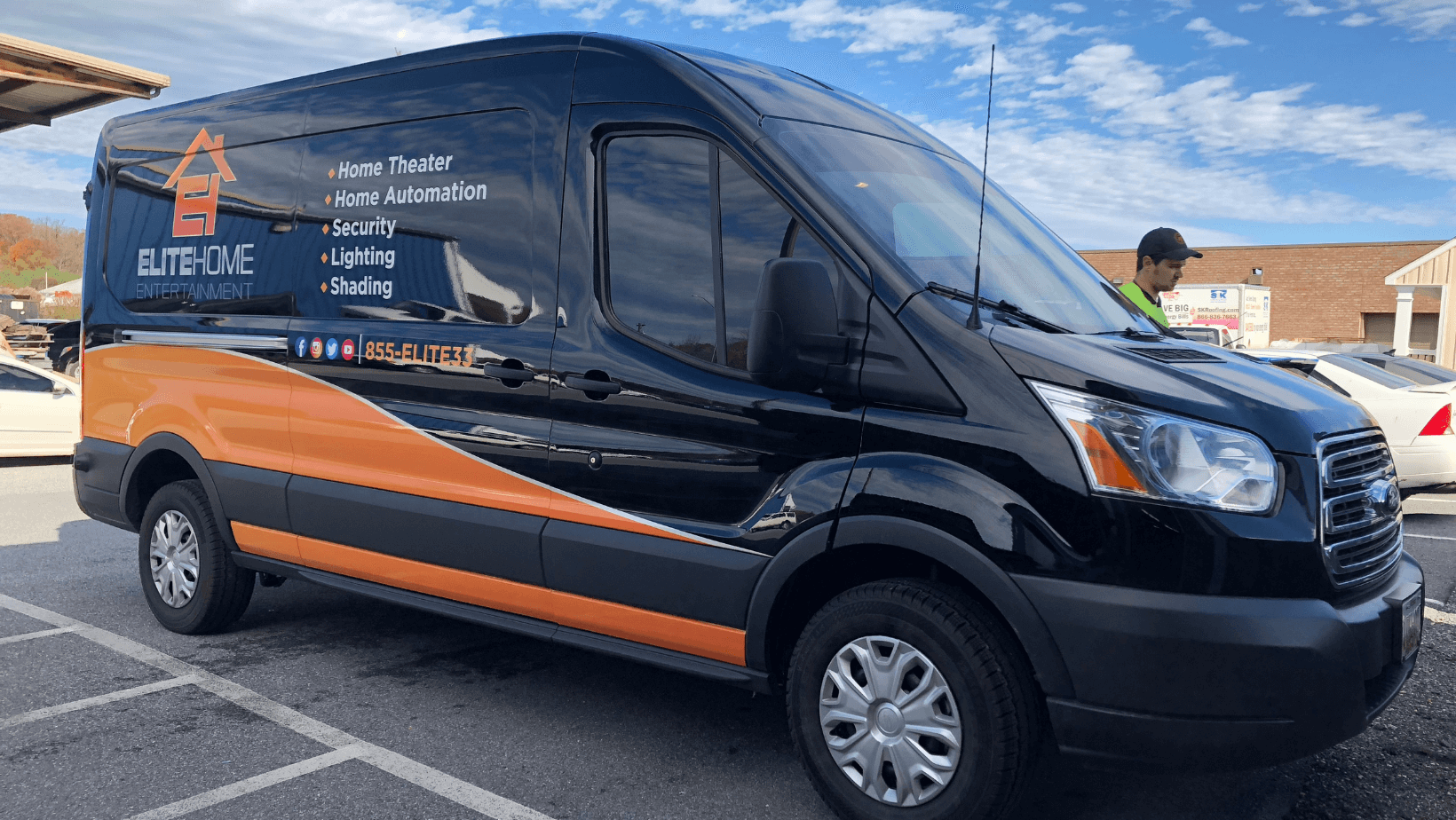 black-van-with-orange-decal-wrap