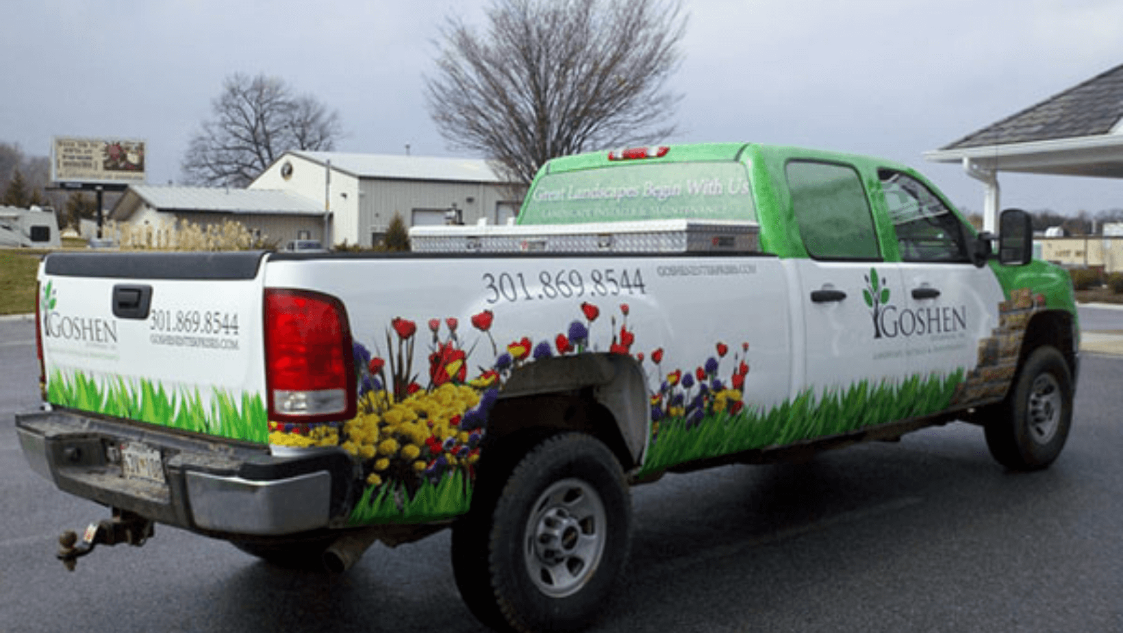 white-and-green-landscaper-vehicle-wrap-with-flowers