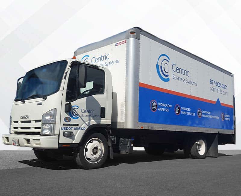 A freight truck sporting a large business vehicle wrap