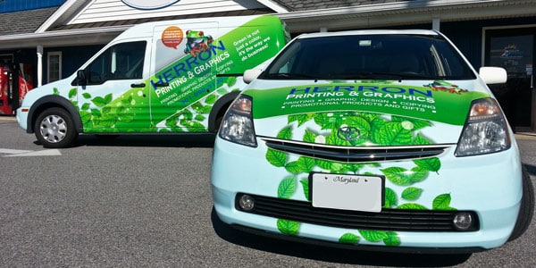 Car and van covered in commercial vehicle wraps