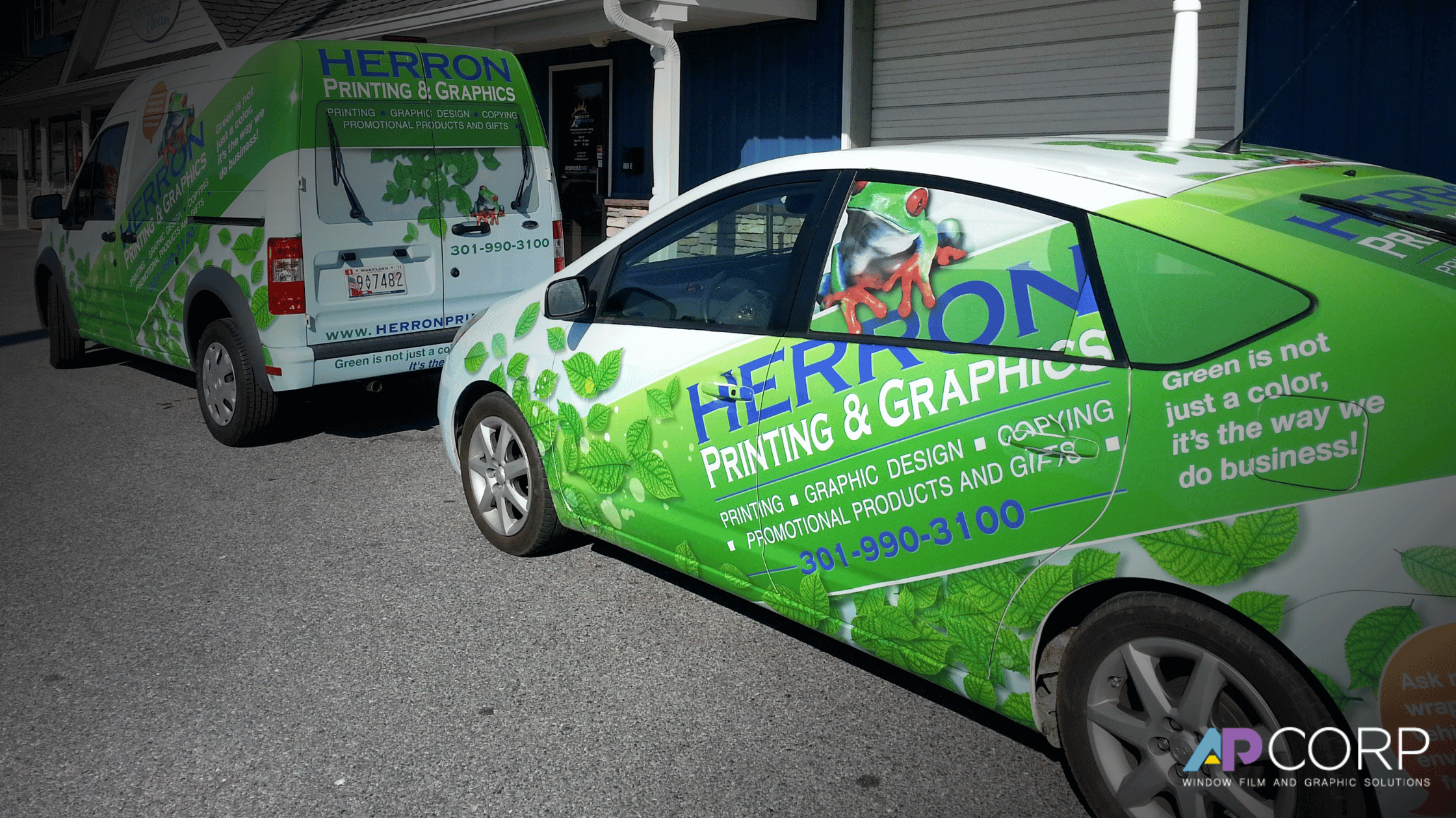 A group of business trucks covered in fleet wraps