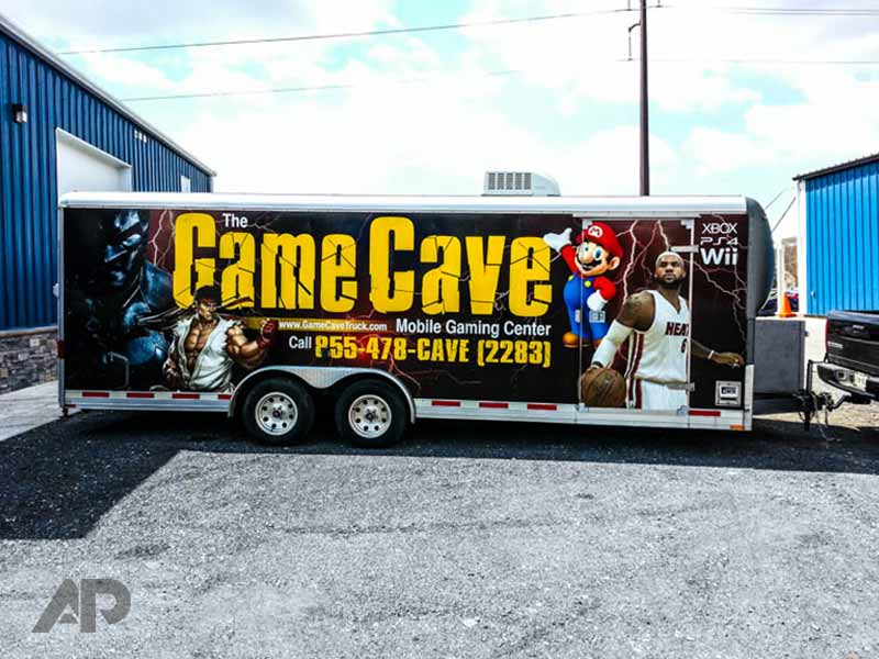 Right side view of The Game Cave trailer advertising wrap