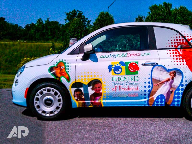 Left side view of My Kidd Smiles Fiat advertising wrap