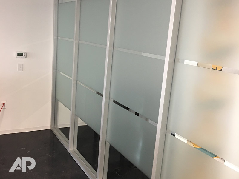 Multiple frosted window films applied to Trade Pacific office windows