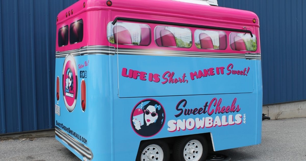 Colorful food trailer wrap for Sweet Cheeks Snowballs mobile dessert business