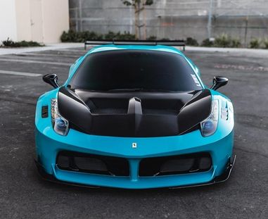 Super gloss vehicle wrap on a luxury sedan with a mirror-like finish