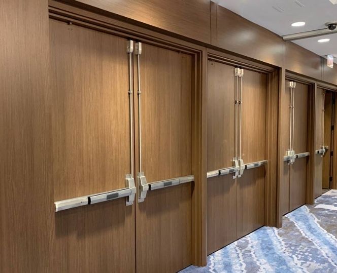 Koroseal Reatec architectural film applied to interior doors for a wood-look finish