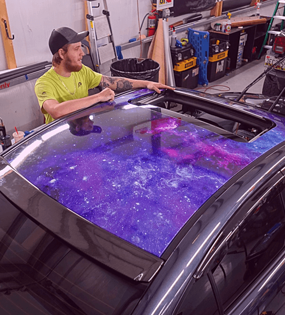 Detailed adhesive graphics installation process for vehicle wraps