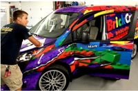 Fleet vehicle wrapping on a box truck with custom vinyl graphics for business branding