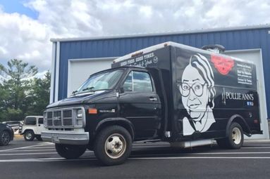 Professional installation of food truck wrap signage for mobile kitchens