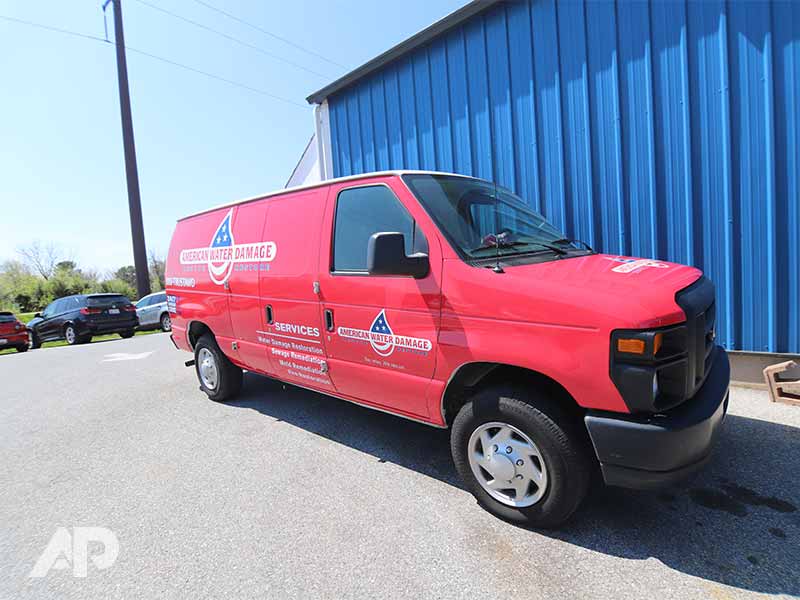 American Water Damage truck wrap front-right angle