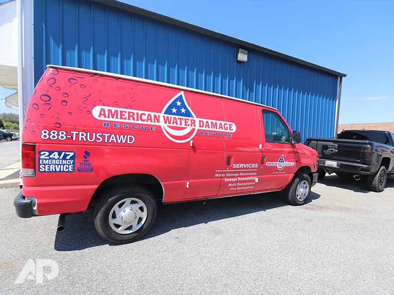 American Water Damage truck advertising wrap right side view