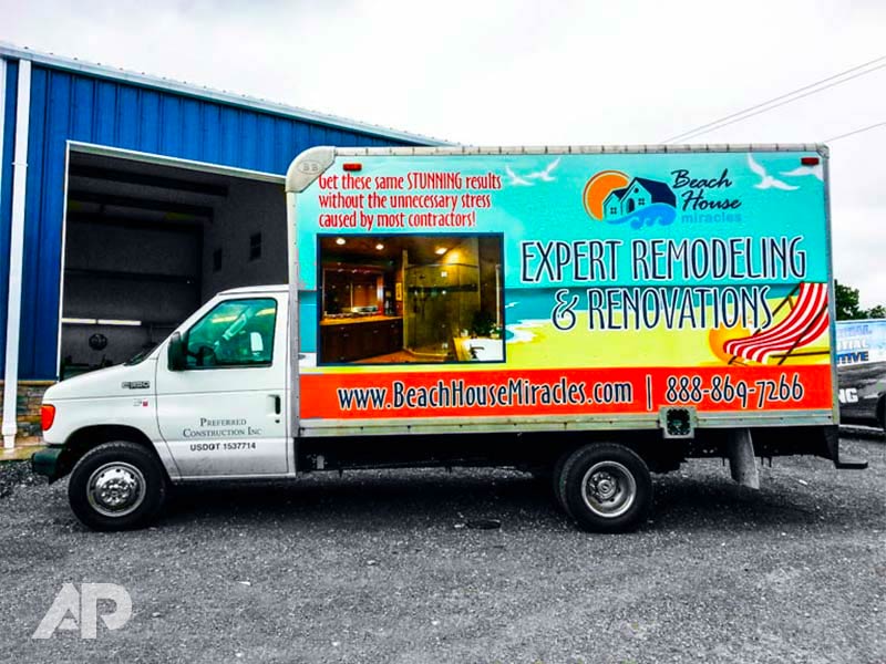 Left side view of Beach House Miracles box truck wrap with beach-inspired graphics