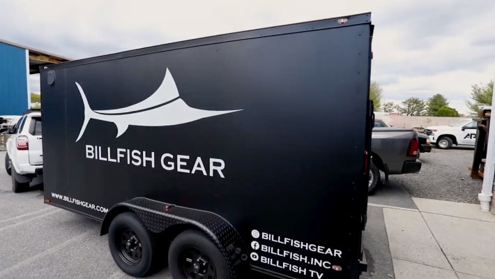 Installing Billfish Gear merchandise trailer graphics