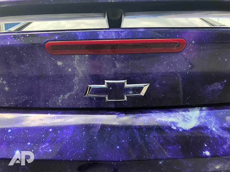 Chevy Camaro with custom metallic galaxy wrap and decal detail