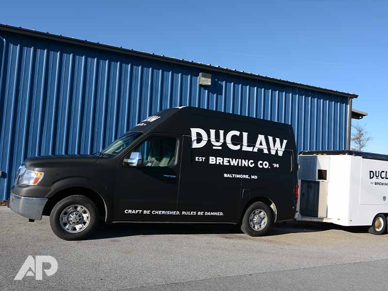 DuClaw advertising wrap on left side of truck