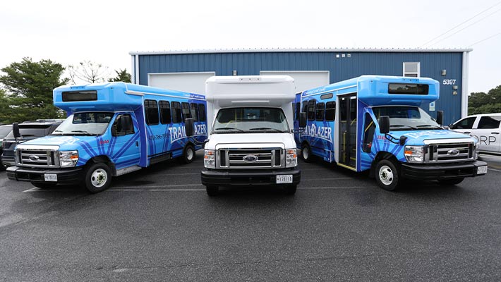 Fleet Vehicles as Mobile and Parked Billboards Fleet vehicle wraps working as parked billboards for outdoor advertising