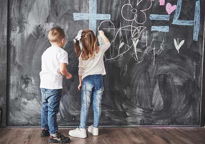 Creative Indoor Activities for Kids | Quarantine Fun and Learning Kids engaging in fun indoor activities with wall murals and interactive play