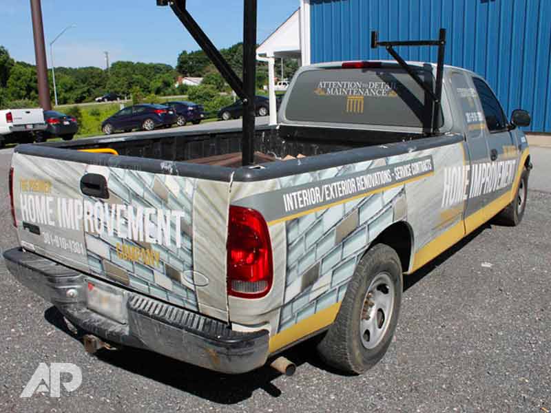 Right back view of Attention to Detail Maintenance pickup truck wrap