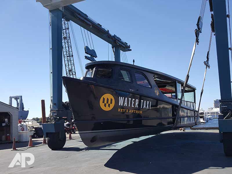 Left-side view of Under Armour boat wrap on water taxi