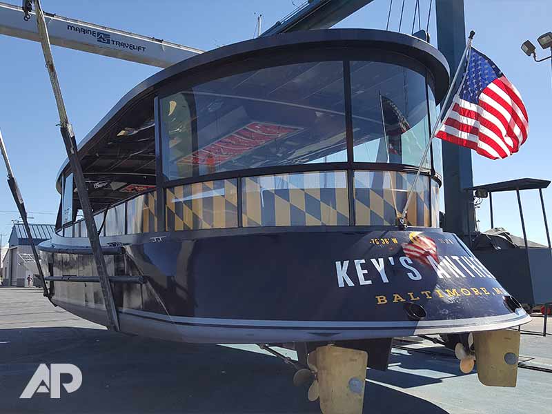 Right-front angle of Under Armour water taxi boat wrap