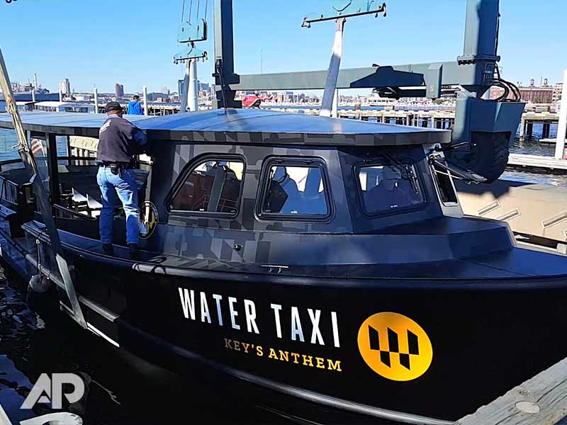 Right-side view of Under Armour boat wrap on water taxi