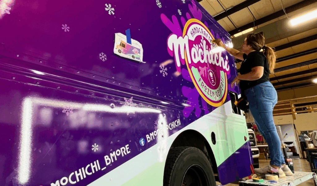 unnamed (11) A skilled technician applying a vinyl wrap to a commercial fleet vehicle.