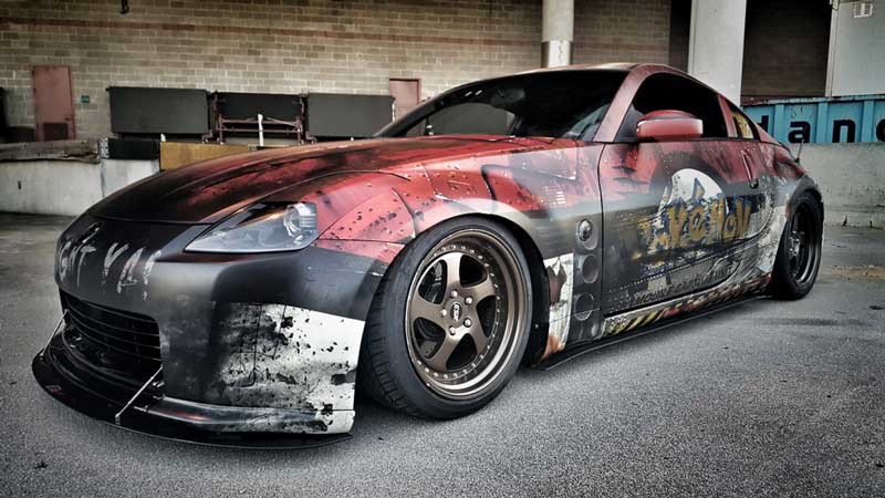 AP Wraps team installing Pokemon vehicle wrap at USSC 2016