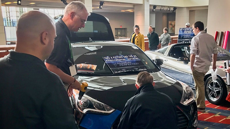 Live vehicle wrap demo by AP Wraps at DC Auto Show