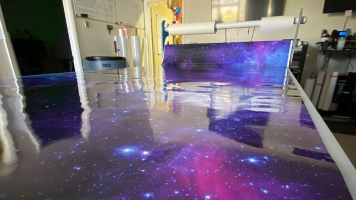 Vehicle wrap overlaminate protecting fleet vehicles from scratches, UV, and moisture