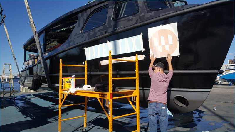Water Taxi boat wrap installation by AP Wraps in Baltimore
